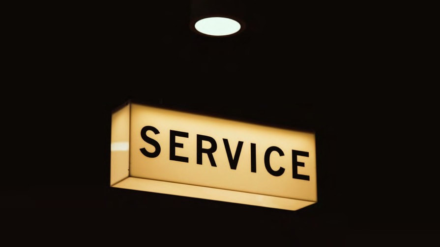 Illuminated Service sign on a black background