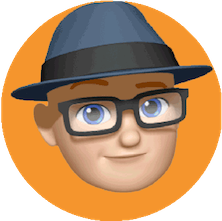 A cartoon or emoji style icon representing Kevin Double on an orange circle. Kevin's emoji is wearing a blue trilby type hat and dark rimmed glasses.